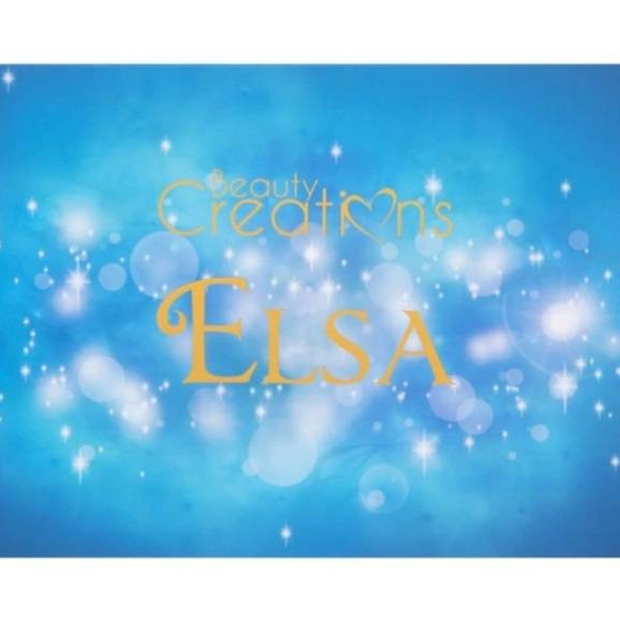 Close-up of Elsa Beauty eyeshadow palette showing shimmering bronze and plum shades with smooth, blendable texture