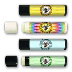 Lip balm tubes with black caps, SweetCombChicago label, and honeycomb pattern design