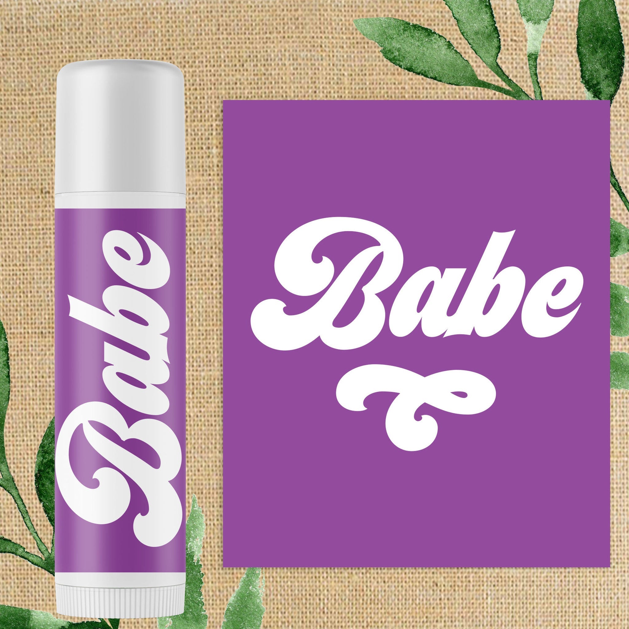Lip balm tube with purple label, white text "Babe", and white cap, on burlap background