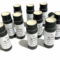 Lip Butter tubes with black cardboard, white labels, and cream balm, LittleStuff4u brand visible