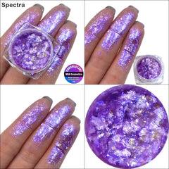 Close-up of iridescent Chromaflake Spectra Eyeshadow Flakes showing multi-color shimmer and textured flake details