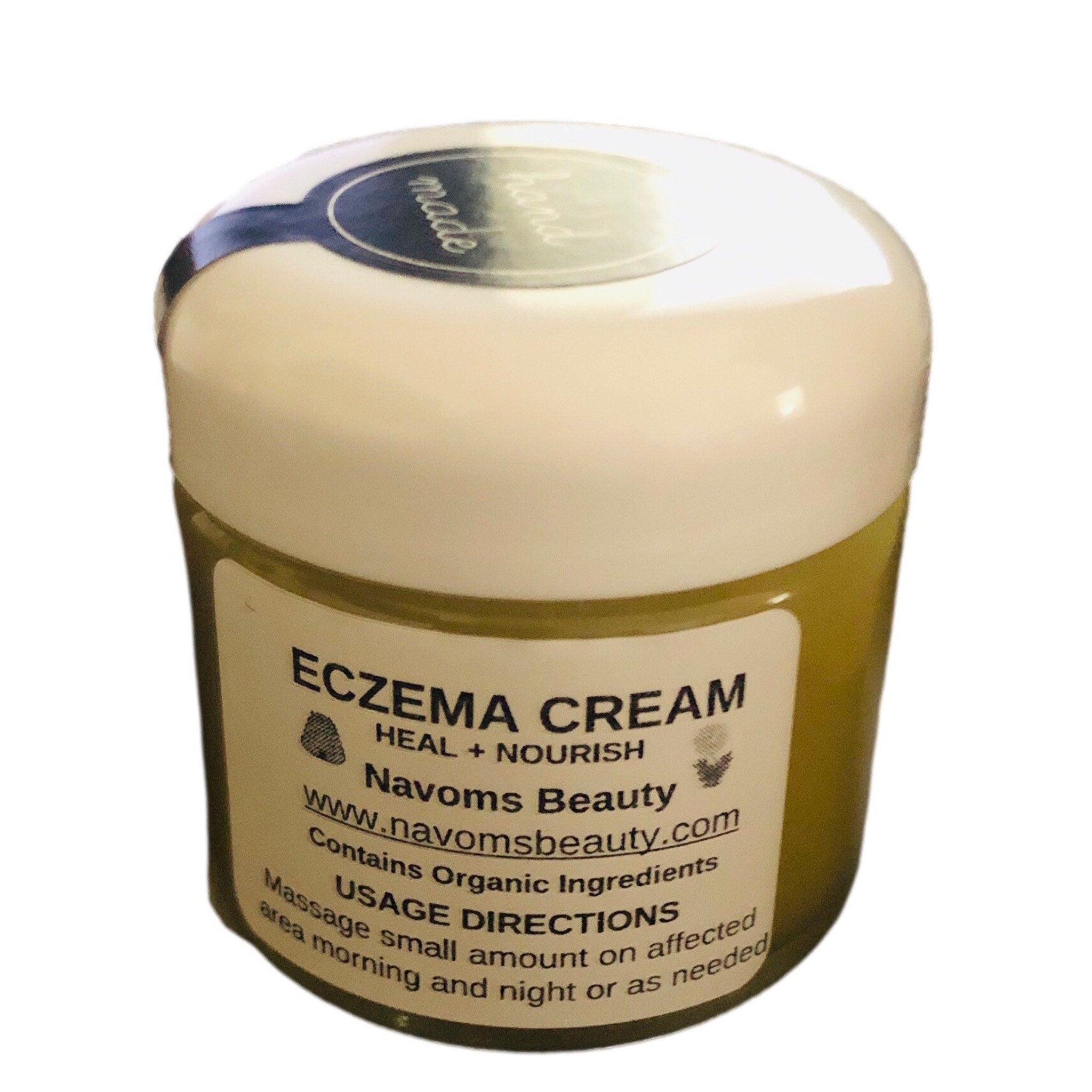 Eczema cream jar with white lid, green body, and Navoms Beauty label showing directions