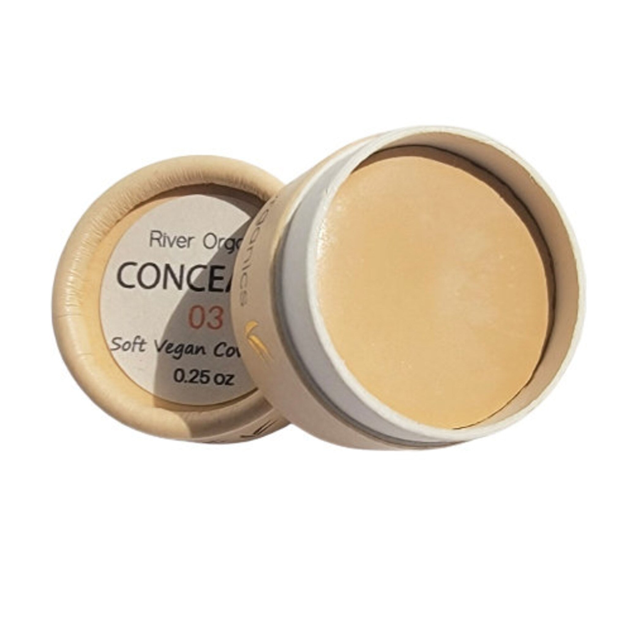Eco-friendly vegan concealer pot with minimalist matte black lid on marble surface