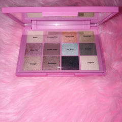 Open Dollface Nudie Boudoir palette displaying 12 matte and shimmer nude eye shadow shades in rectangular pans