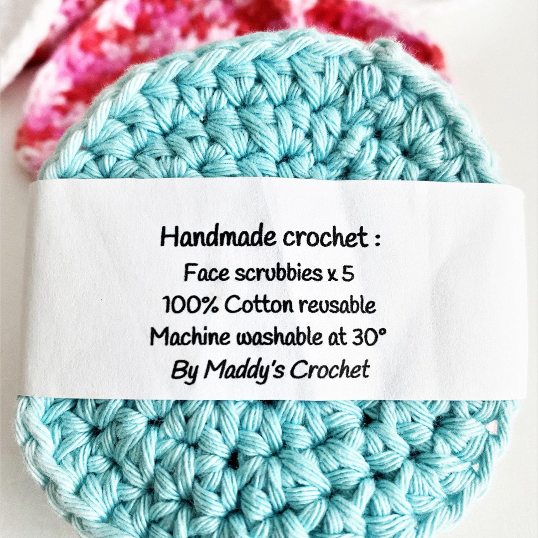 Face scrubbies, light blue crochet, handmade, with "Maddy's Crochet" text on label