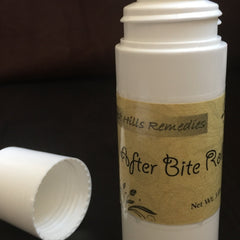 After Bite Roll-on white plastic bottle with tan label, black text, and lid off