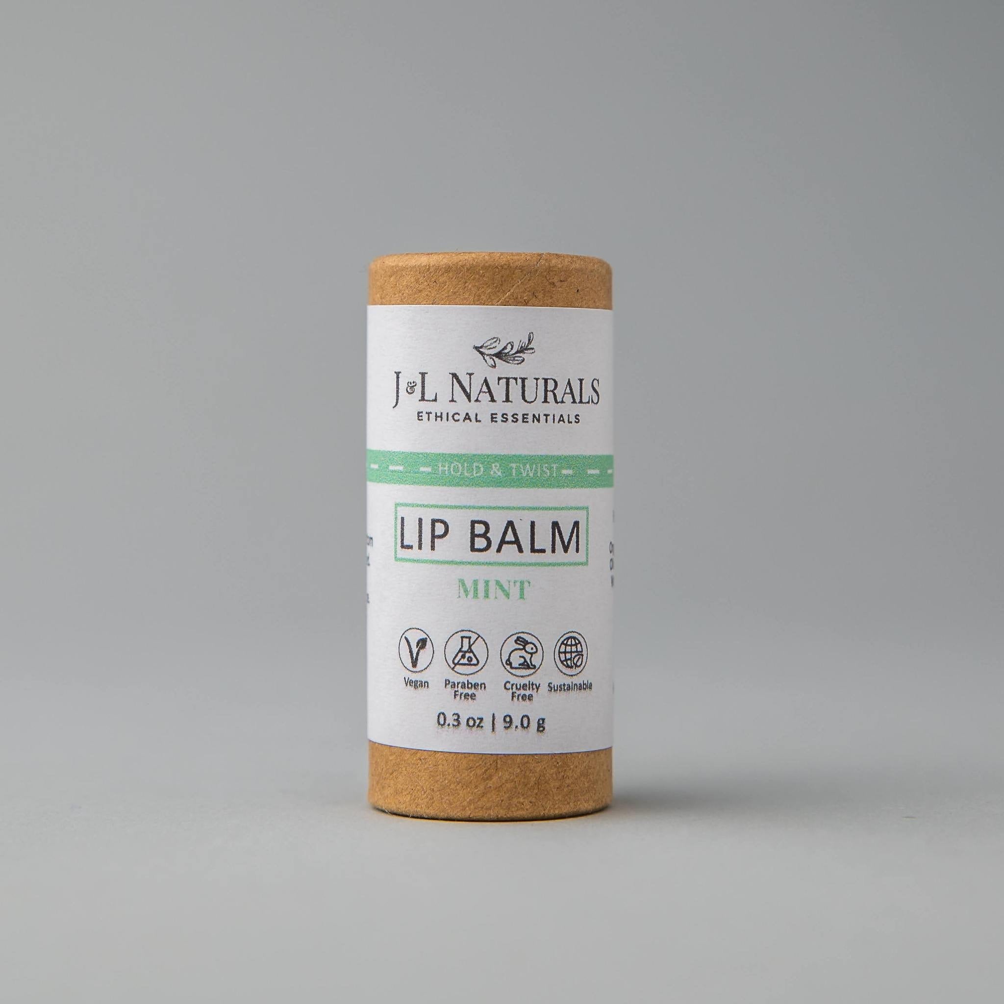 Lip balm tube with brown cardboard base, white label, and J&L Naturals branding
