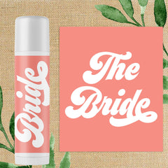 Lip balm tube with white and pink color, "Bride" text, and white cap for wedding favors