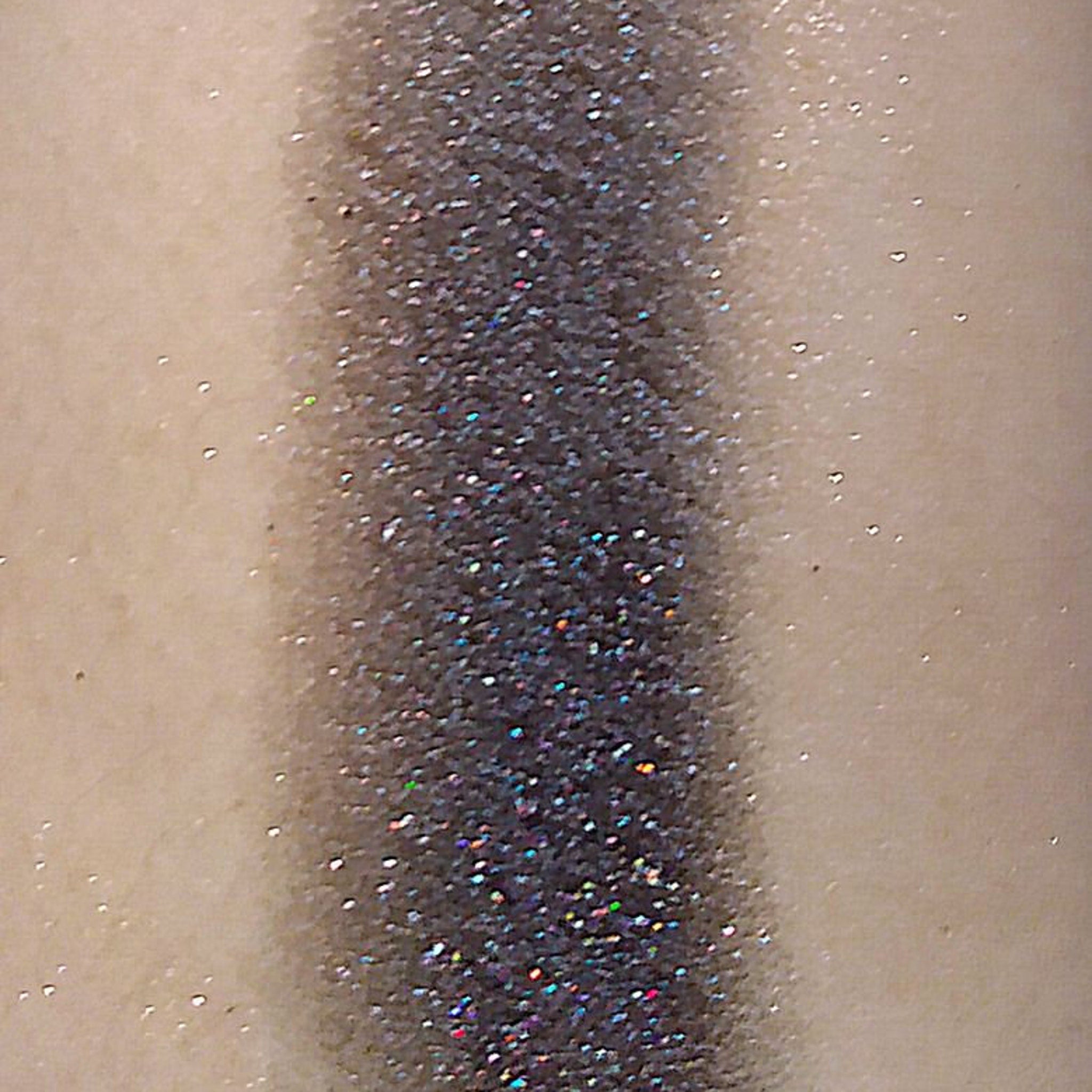 Close-up of Queen of Damn Near Everything Eyeshadow palette showing rich, pigmented powder textures in vibrant jewel tones