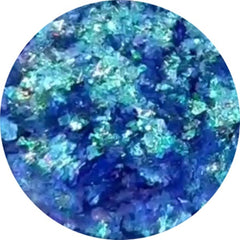 Hand applying iridescent Prism Chromaflake Eyeshadow Flakes to eyelid with fingertip for sparkling effect