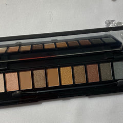 Close-up of matte and shimmery eyeshadow palette showing rich pigmentation in neutral office-appropriate shades