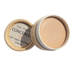 Hand applying vegan zero waste concealer with fingertip to under-eye area for smooth coverage