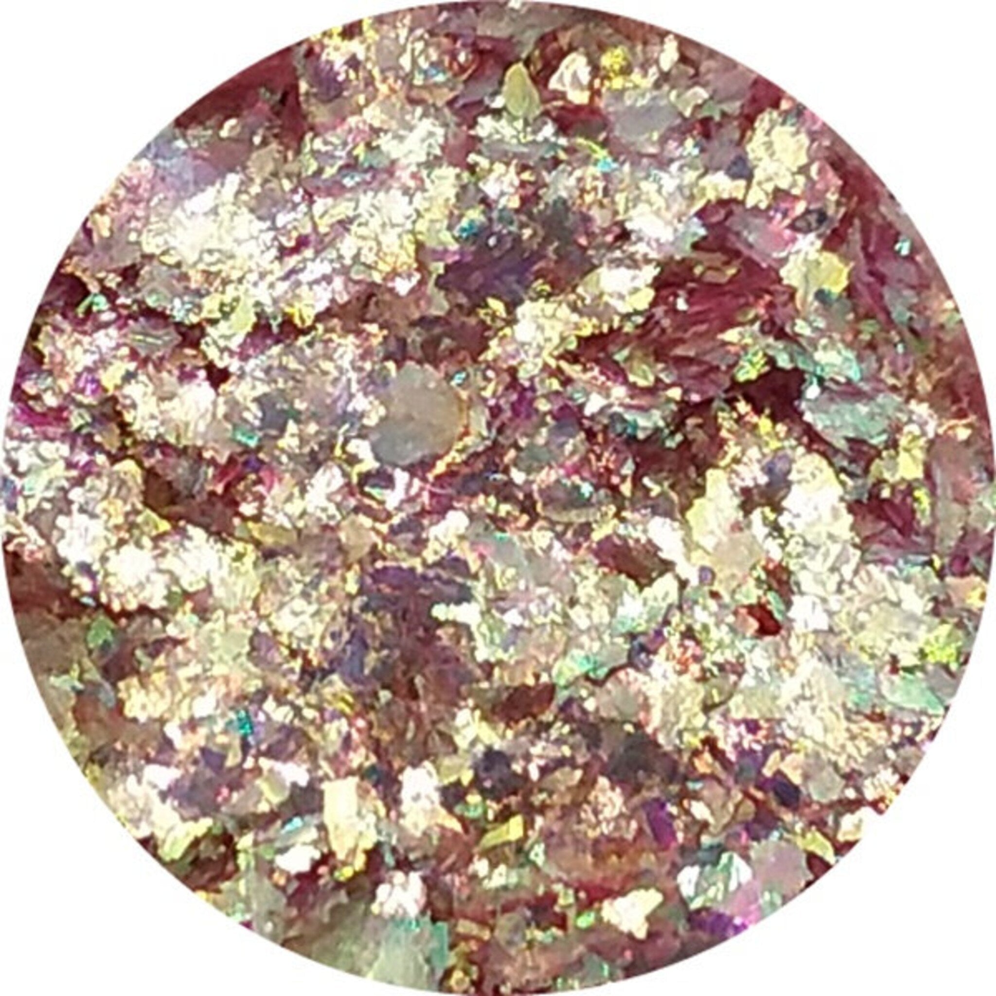 Hand applying iridescent purple chromaflake eyeshadow with fingertip for bold shimmer effect