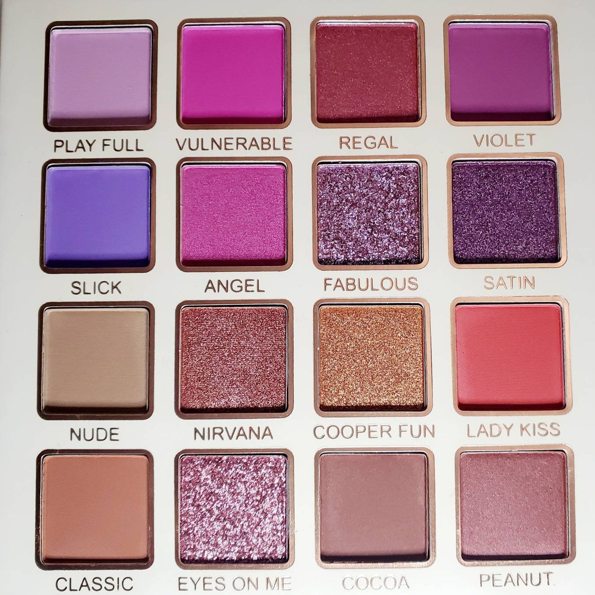 Side view of Bella Forever Medusa II Eye Shadow palette showing sleek black compact with shimmering gold accents