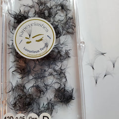 Eyelash extensions in black, clustered style, with Kimeyelashes branding on a white background