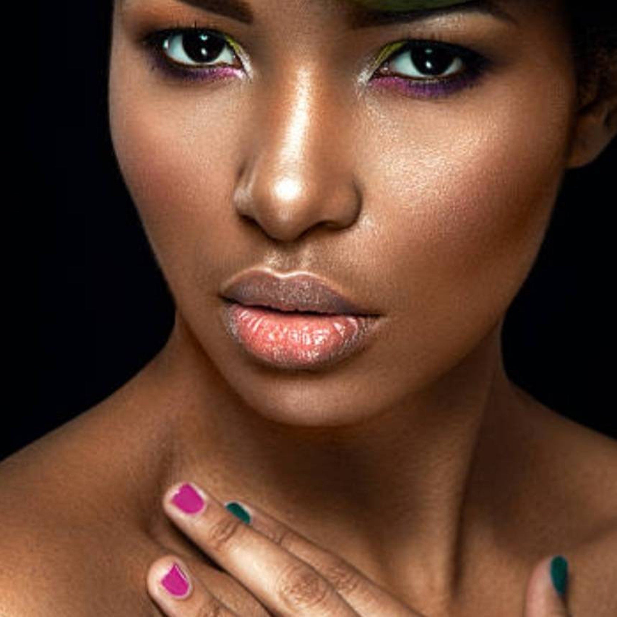 Side view of 35-color eyeshadow palette showing rectangular pans with matte and shimmer finishes in neutral and bold hues