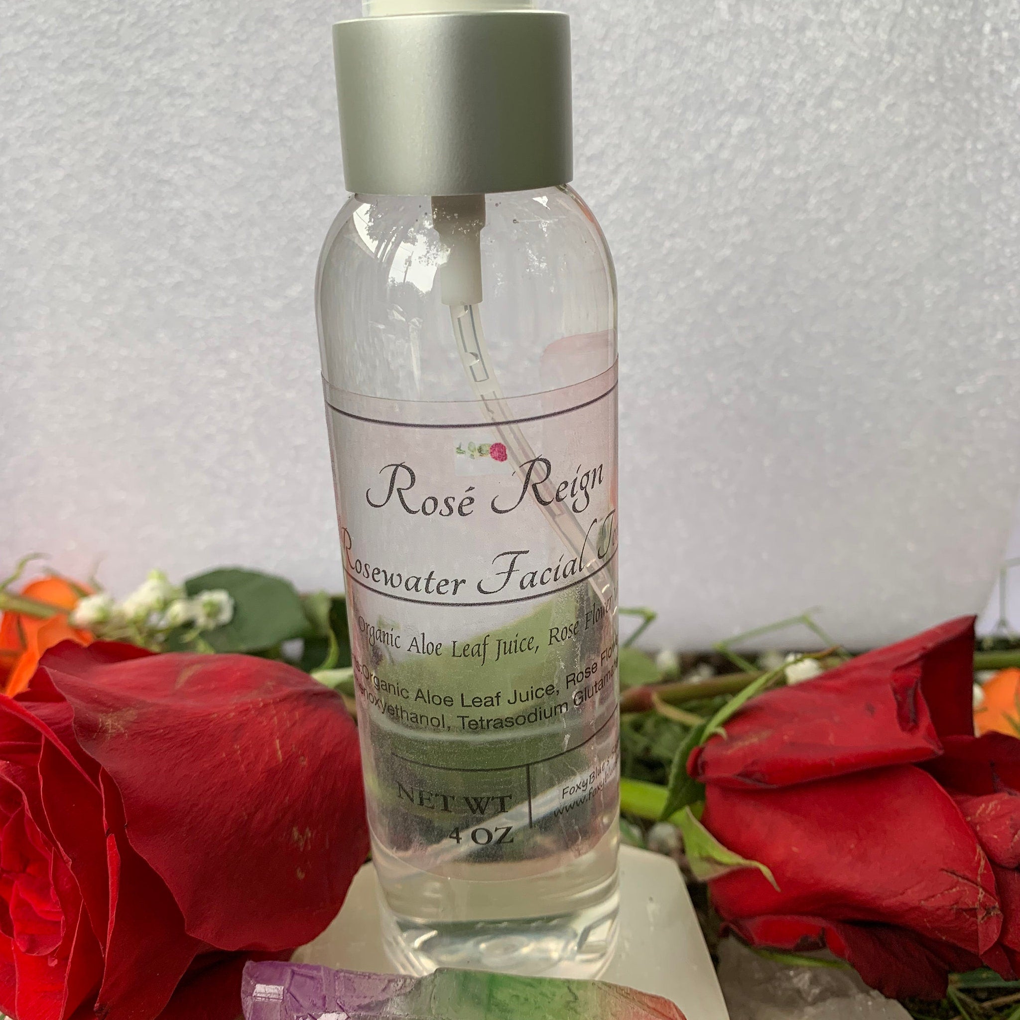 Rosewater Facial Spray bottle, clear glass, silver cap, "Rosé Reign" label