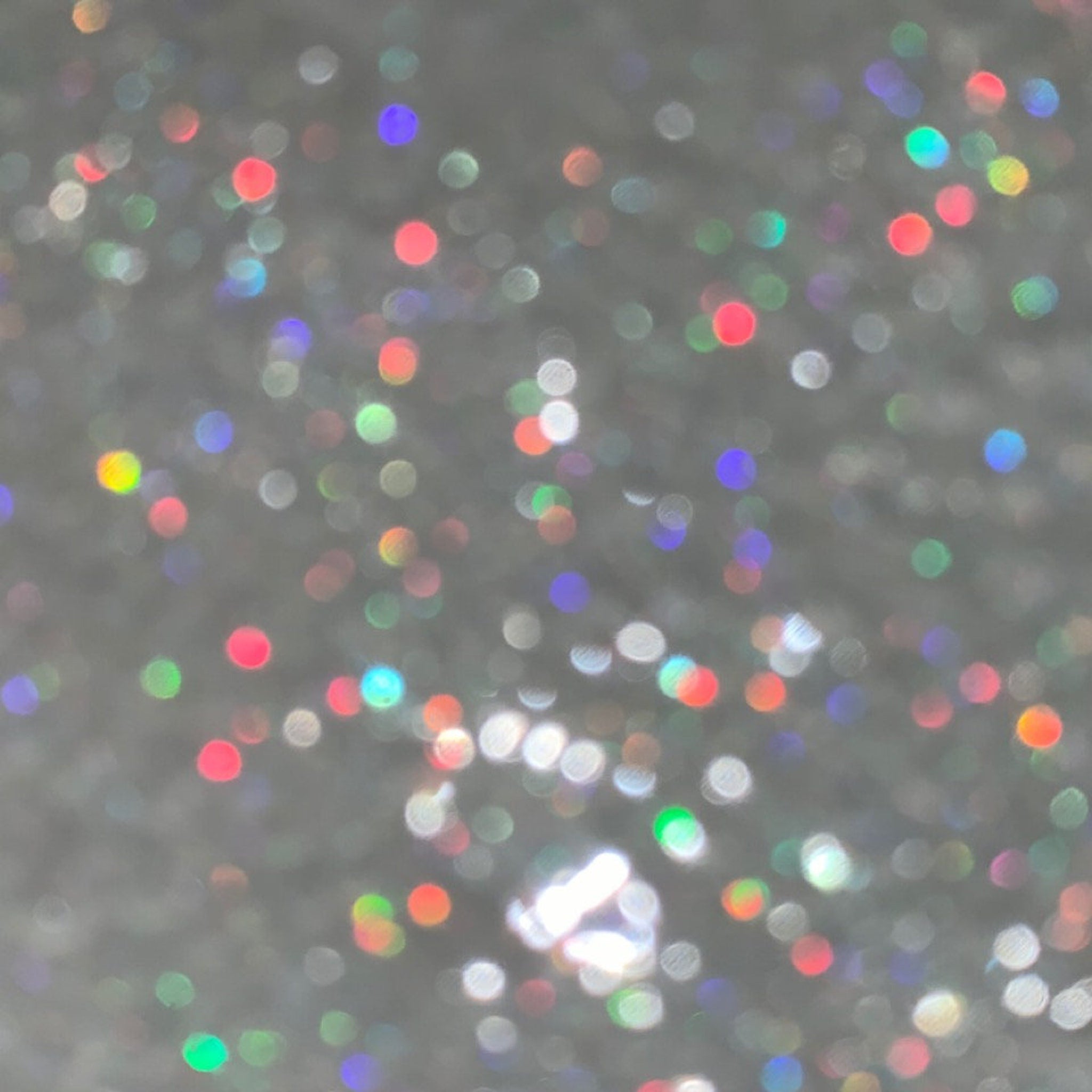 Glitter background of silver with colorful bokeh effect, for design use