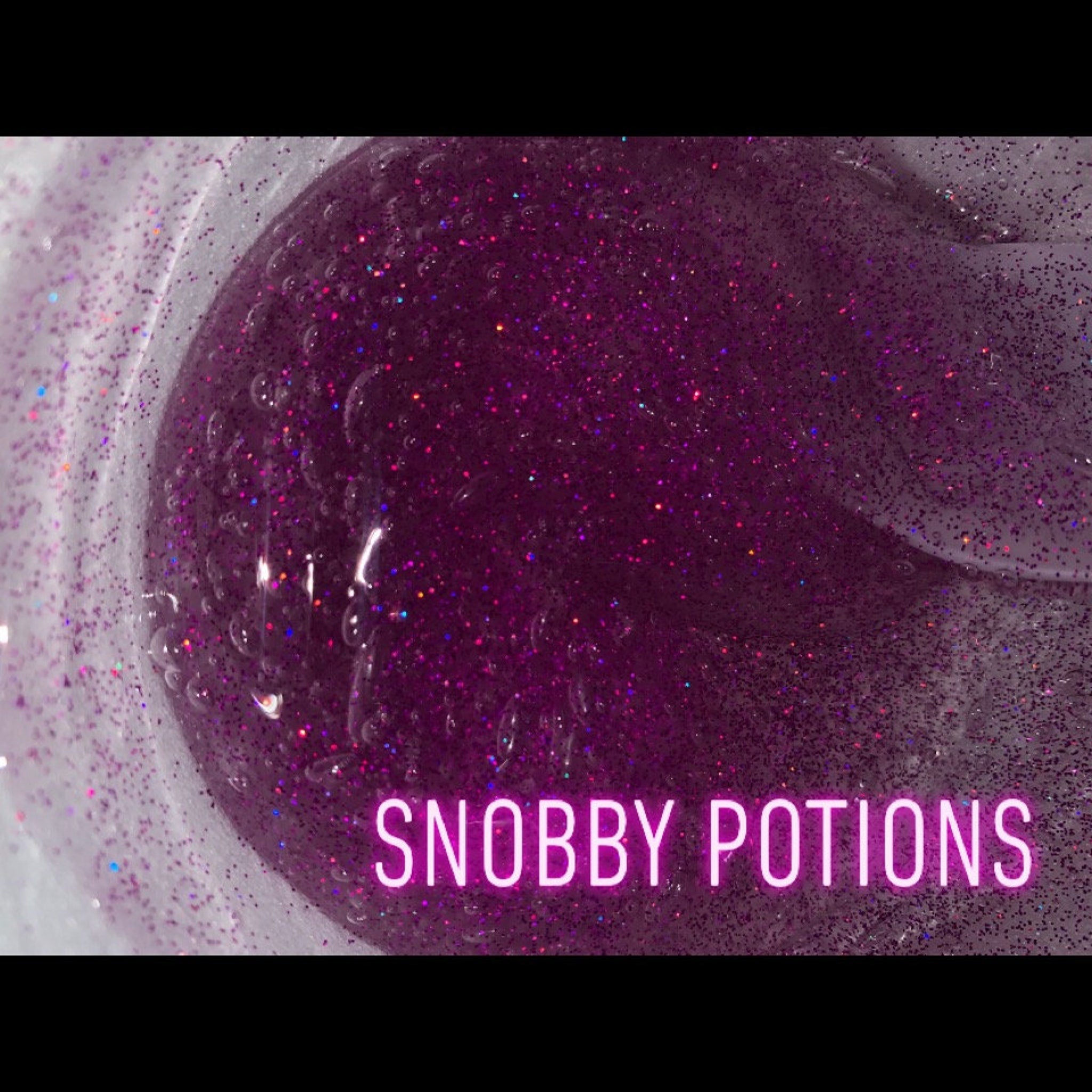 Purple glitter gel with Snobby Potions text, clear container with glitter details and texture