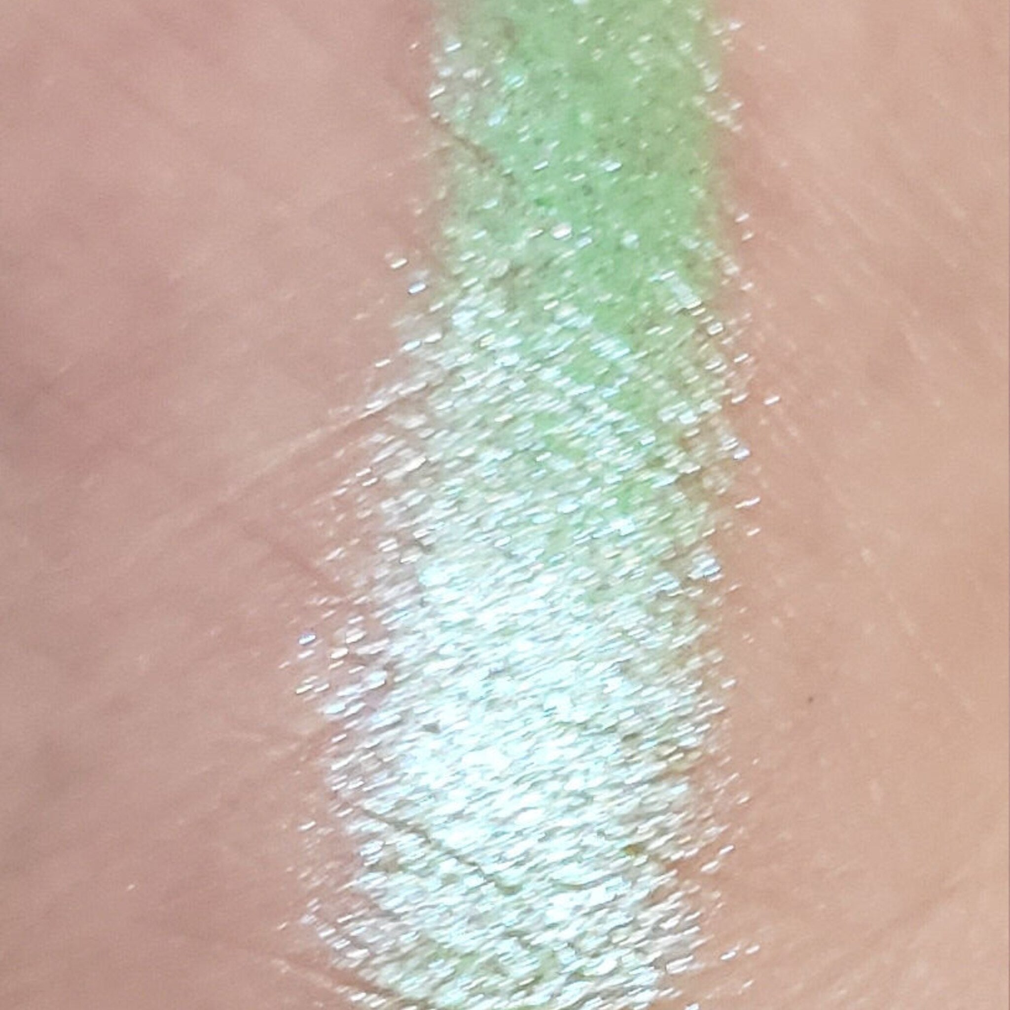 Close-up of the Globetrotter Eye Shadow Palette showing vibrant matte and shimmer shades in earthy tones