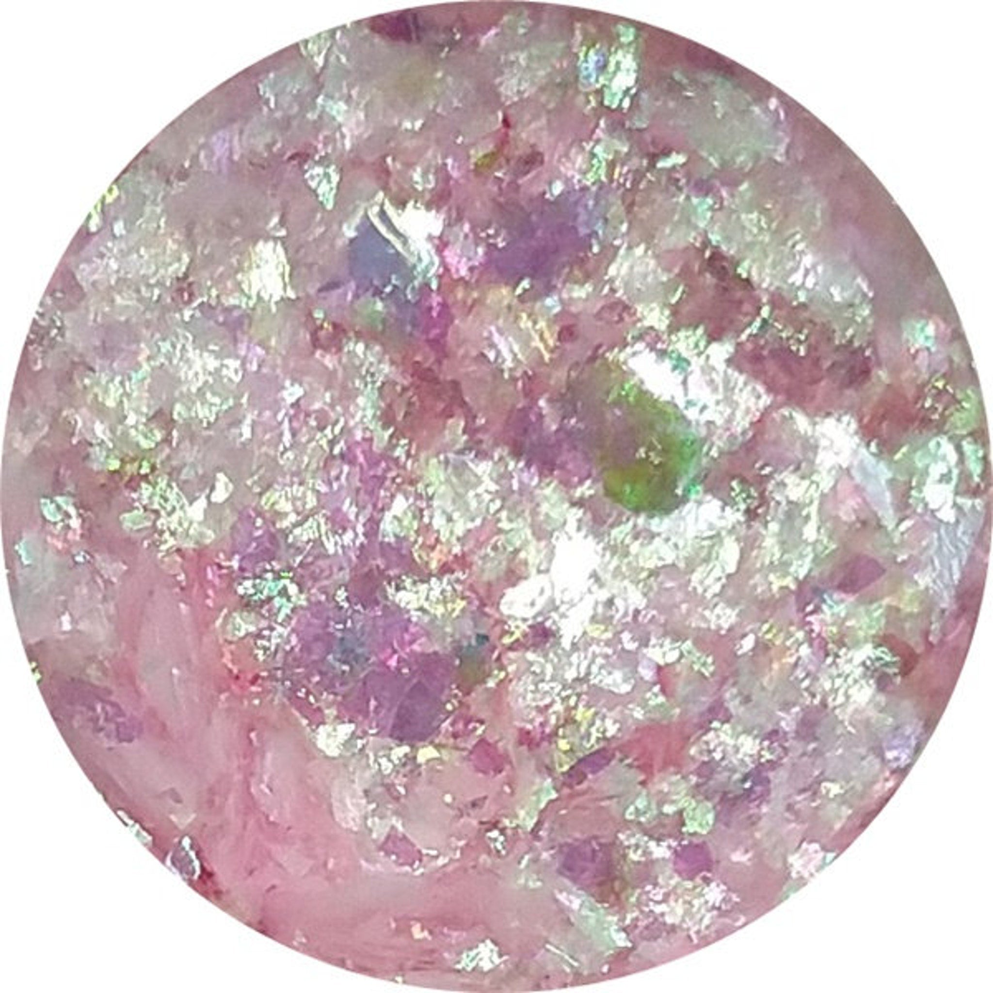 Close-up of iridescent pink and blue chromaflake eyeshadow with sparkling glitter particles in compact palette
