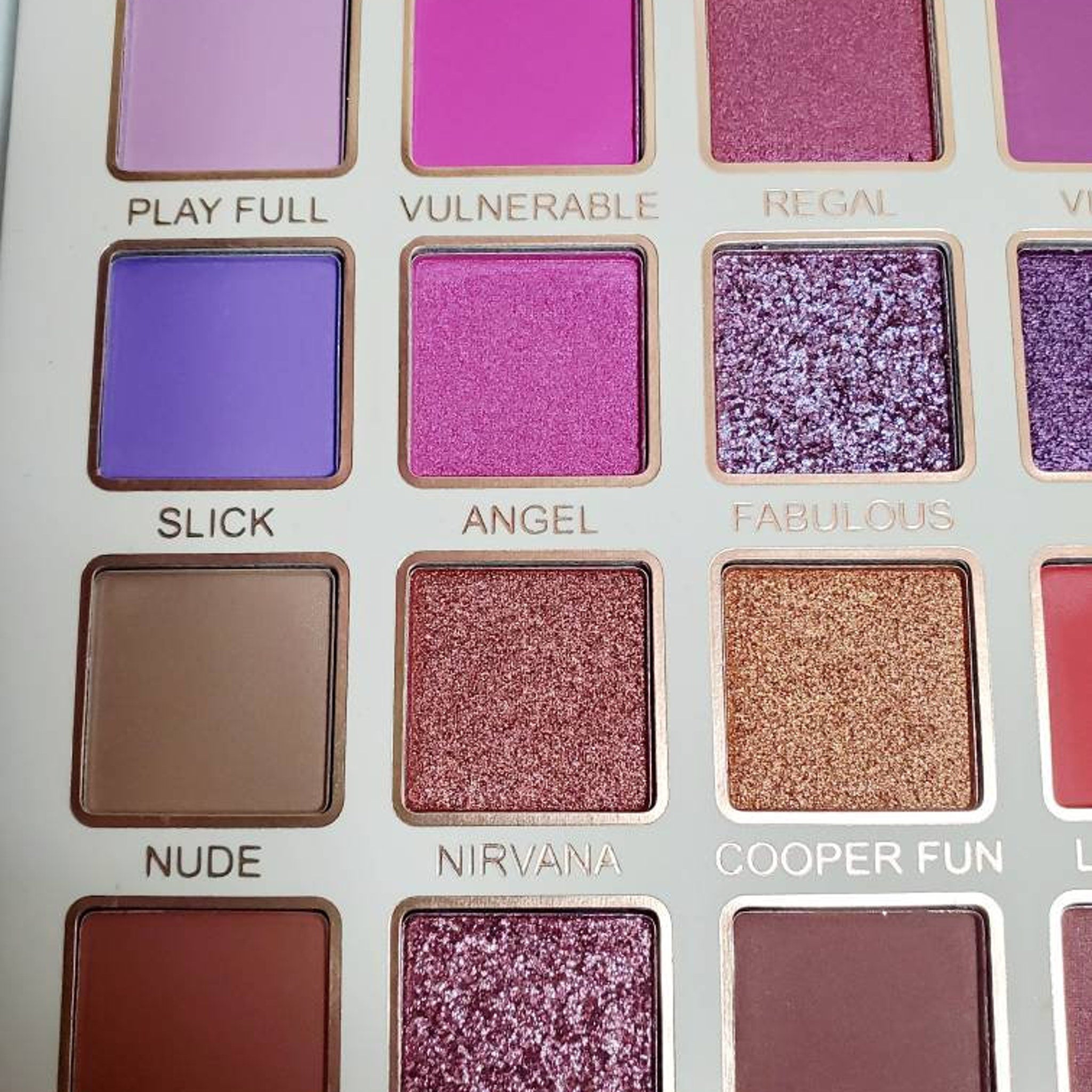 Side view of Bella Forever Medusa II Eye Shadow palette showing shimmering gradient hues in compact case
