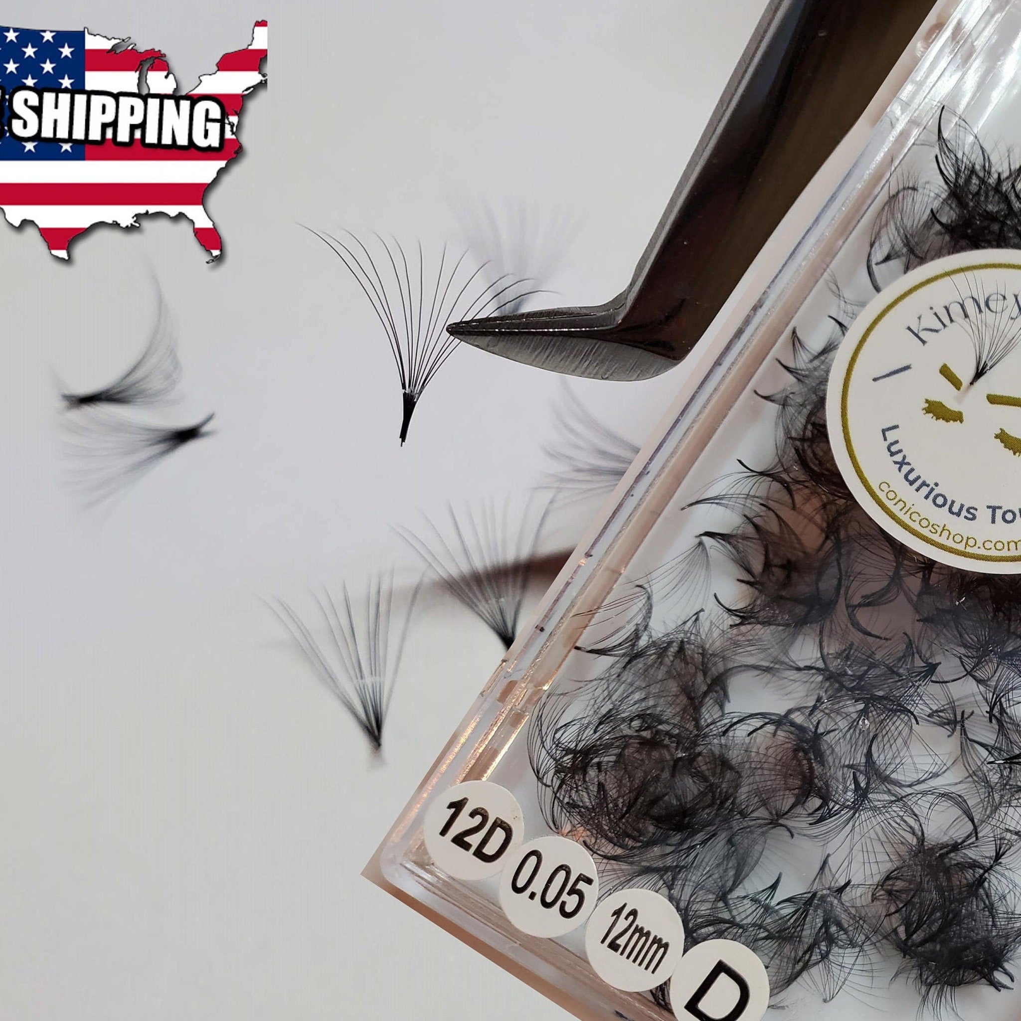 Eyelash extensions black fan lashes with clear packaging and tweezers holding one fan