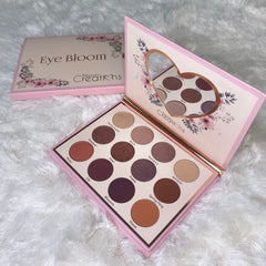 Close-up of Bloom Eyeshadow Palette showing six matte and shimmer shades in warm neutrals and soft pinks