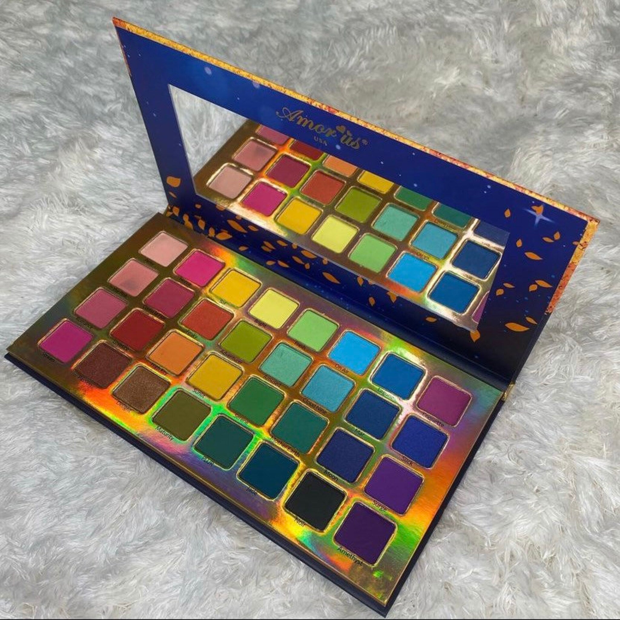 Remember Me eyeshadow palette featuring 12 vibrant matte and shimmer shades in a sleek black compact