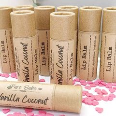 Lip Balm tubes in tan cardboard with printed labels, Pure Bubs brand, and pink heart sprinkles