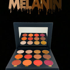 Close-up of Melanin Eyeshadow Palette showing rich matte and shimmer shades in warm browns and golds