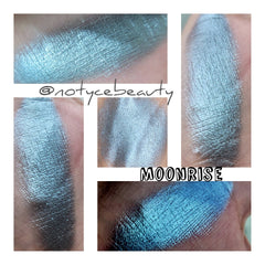 Side angle of Moonrise Chameleon Eye Shadow pot showcasing icy blue to grey shift with sparkling shimmer particles