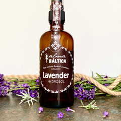 Lavender Hydrosol bottle, brown glass, white label with Alma Baltica text, purple flowers around