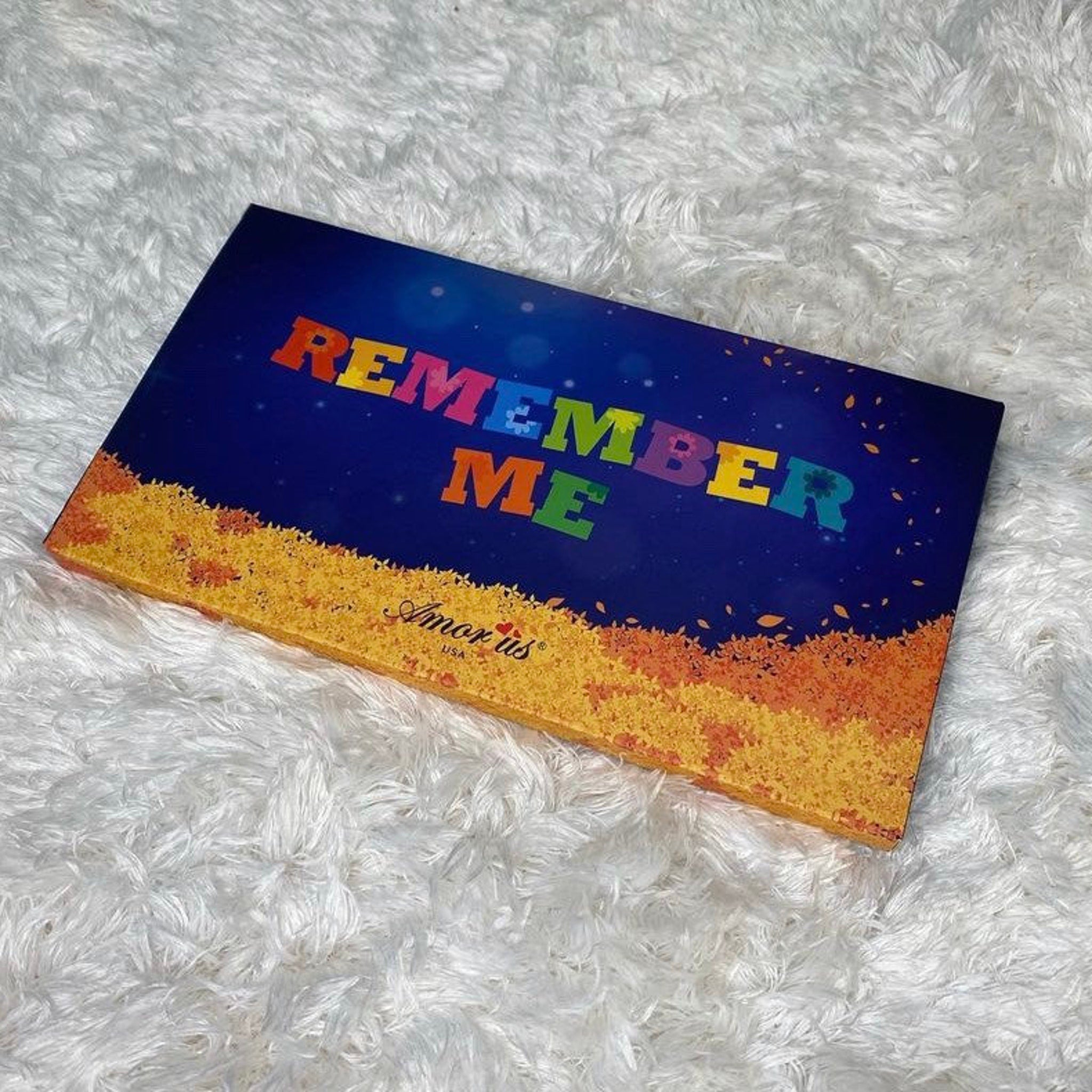 Close-up of Remember Me palette showing six matte and shimmer eyeshadows in warm nude and mauve tones