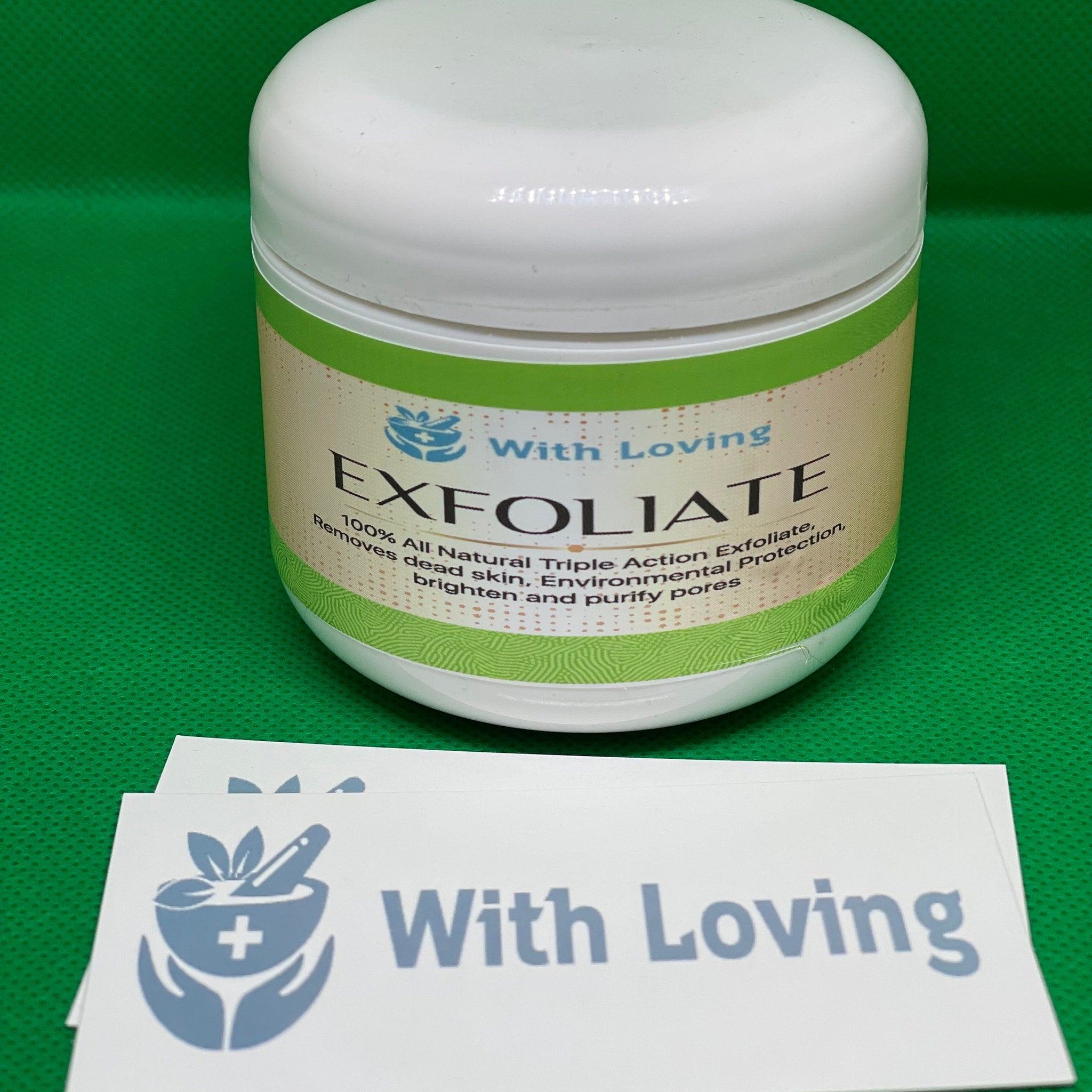 Facial Cleanser jar, white plastic, green label with With Loving and Exfoliate text