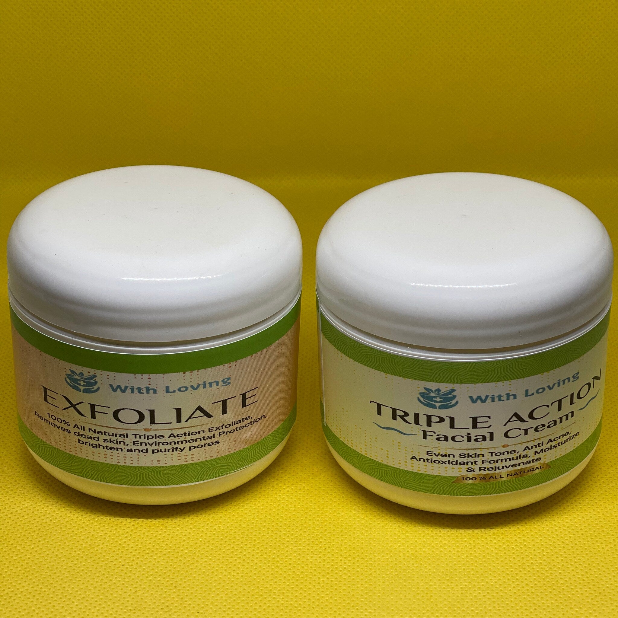 Facial cream jars, white plastic with green and tan labels, on yellow textured background With Loving brand