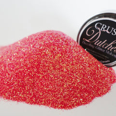 Close-up of silver glitter eye shadow with high-shine metallic finish in a small round jar