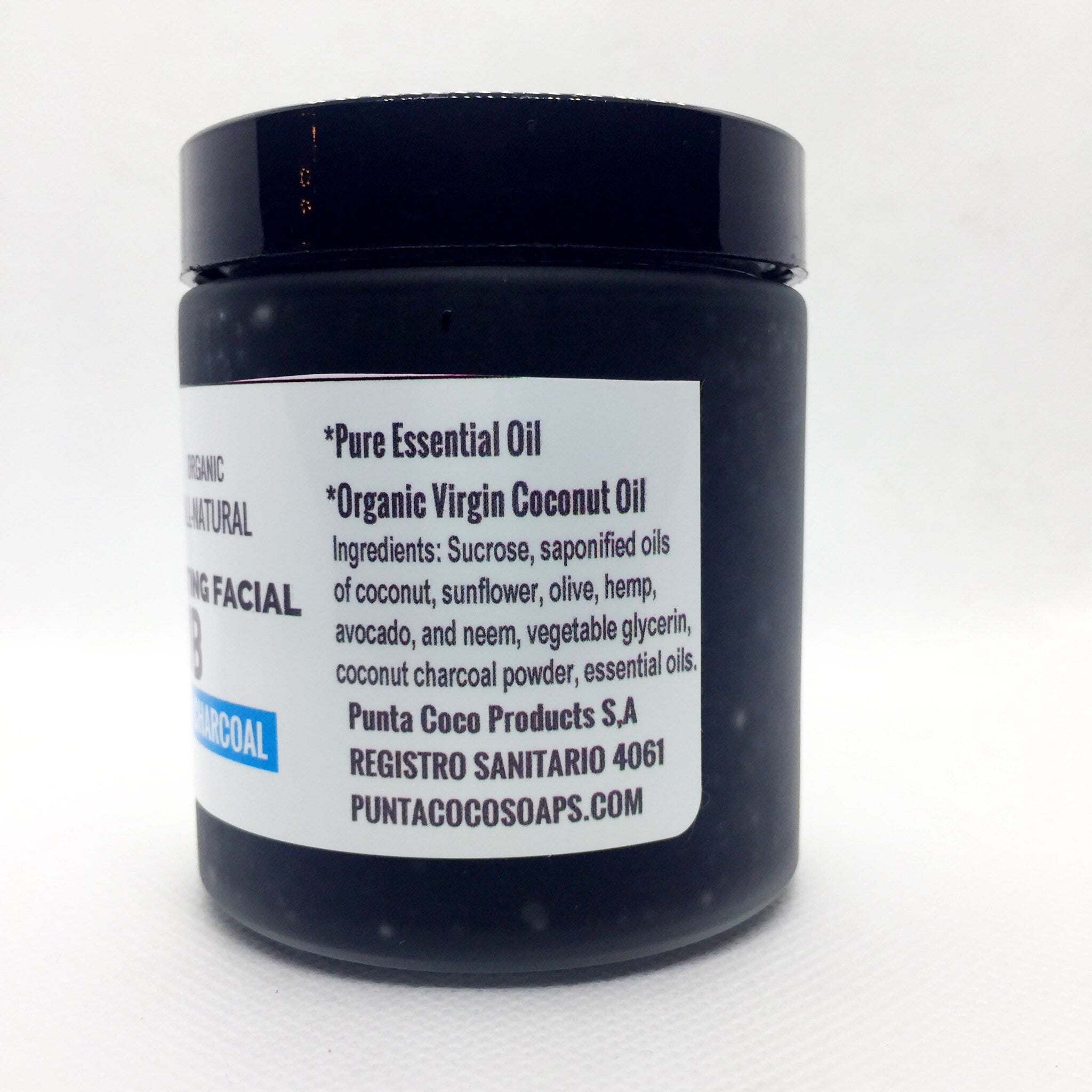 Facial scrub jar, black glossy container, white label with text, charcoal ingredient