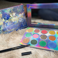 Side view of Galactic Astronomy palette showcasing twelve vibrant matte and shimmer eyeshadows in cosmic hues