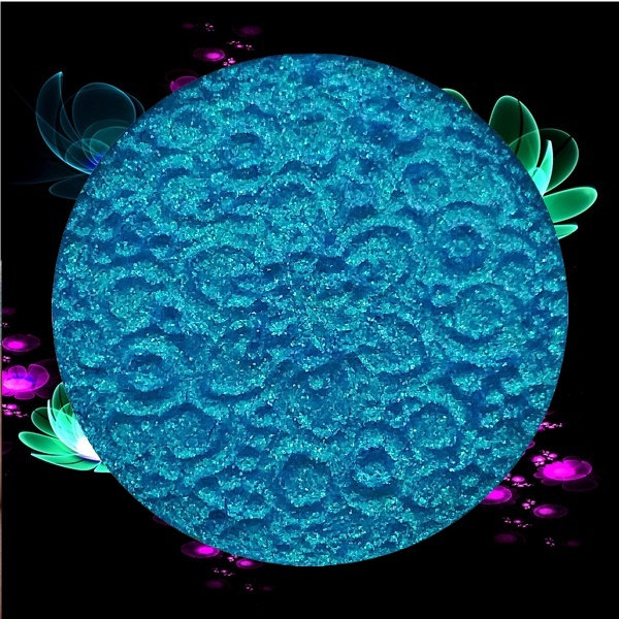 Side view of duochrome Infinite Aster eye shadow showing color shift from lavender to teal in compact palette