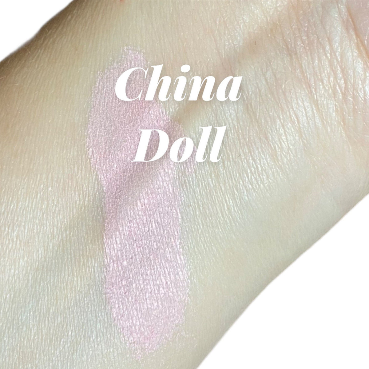 China Doll mineral eyeshadow pot with pale pink shimmer and vegan luster finish, shown open