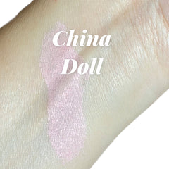 China Doll mineral eyeshadow pot with pale pink shimmer and vegan luster finish, shown open