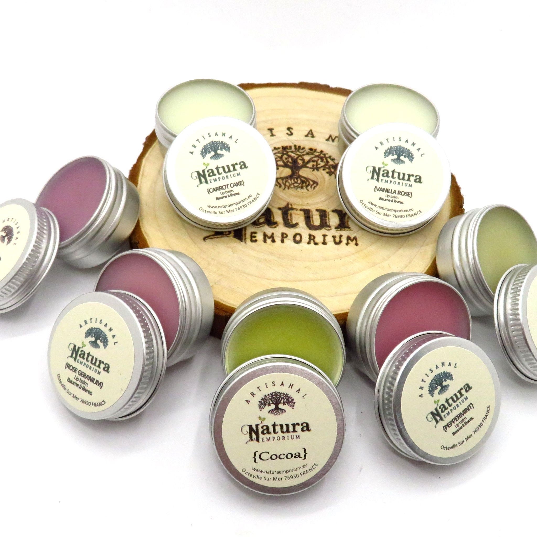 Lip balms in silver tins, with Natura Emporium labels, various colors on display