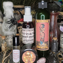Bottles and jars of various sizes, with black, white, and brown labels, some with cork stoppers, arranged on a surface
