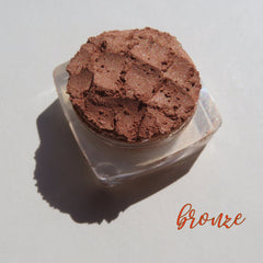 Bronze copper brown loose mineral eyeshadow with shimmer in a clear sifter jar, vegan and cruelty-free