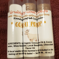Lip balm tubes with white labels, "Goat Poop" text, and goat illustration, Grubby Goat Soaps brand