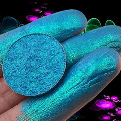 Close-up of duochrome Infinite Aster eyeshadow shifting from violet to teal with metallic sheen