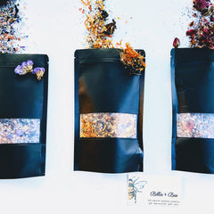 Black pouches with clear window, dried flowers, and Billie Bee branding