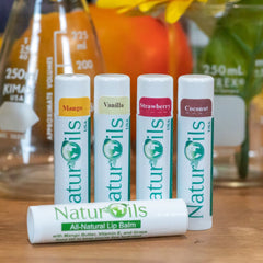 Lip balms, white tubes with flavor labels, NaturOils brand name visible