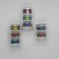 Side view of multichrome eyeshadow bundle showing shifting iridescent hues in compact pans